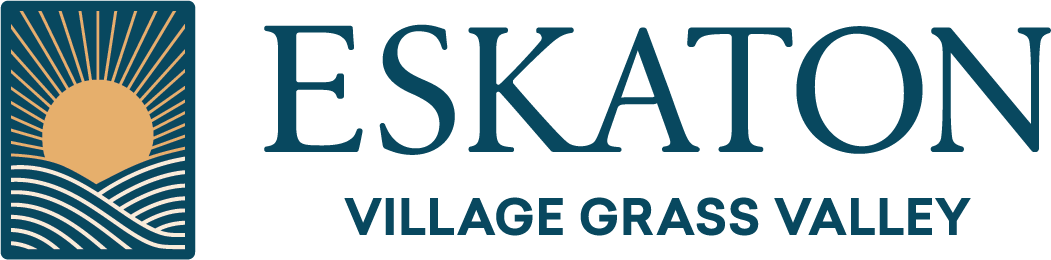 Logo for Eskaton Village Grass Valley. On the left, a graphic depicts a stylized sun rising over wavy lines, representing hills or fields. The text ESKATON is large, with VILLAGE GRASS VALLEY underneath.